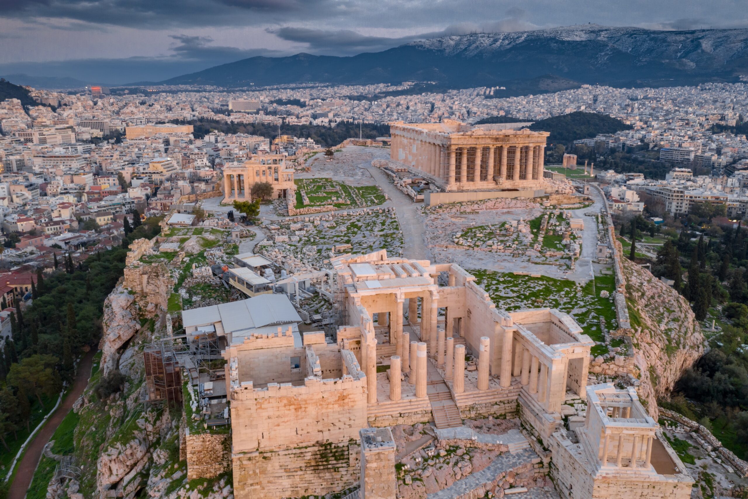 Aerial view of Acropolis of Athens, the Temple of Athena Nike, Parthenon, Hekatompedon Temple, Sanctuary of Zeus Polieus, Odeon of Herodes Atticus, Erechtheion at sunset