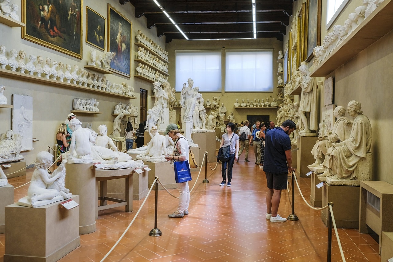 Florence, Italy - June, 3, 2018: Visitors in a museum of Florence Academy of fine arts (Accademia di belle arti di Firenze)