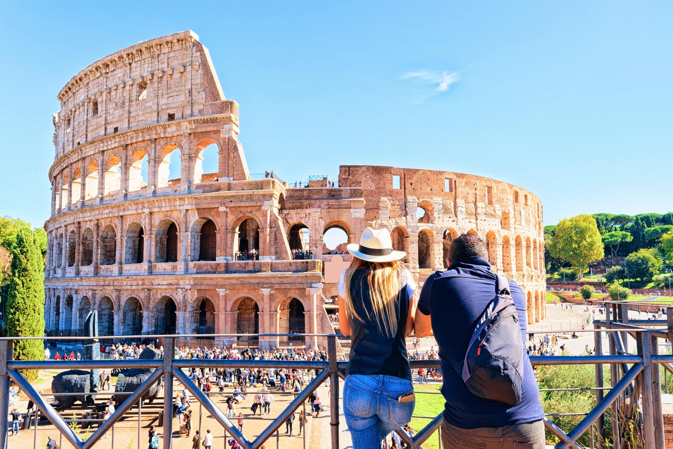 Young,Couple,At,Colosseum,In,The,Old,City,Center,Of