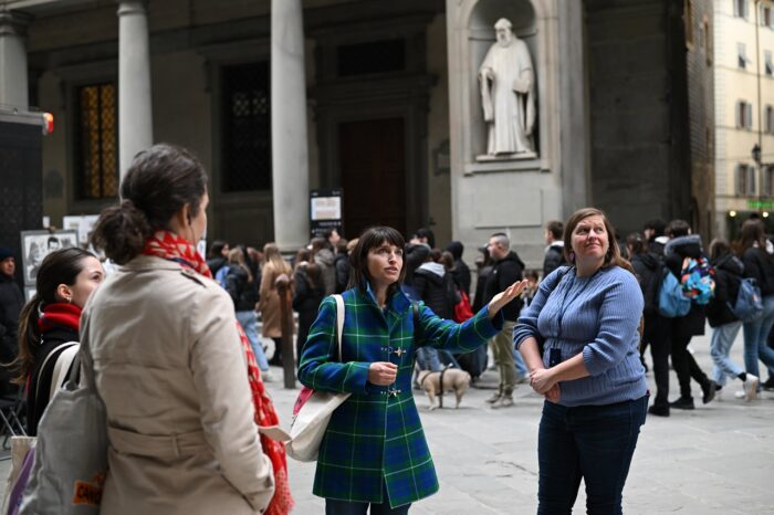 a group of people walking down the street