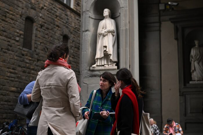 a group of people standing in front of a building