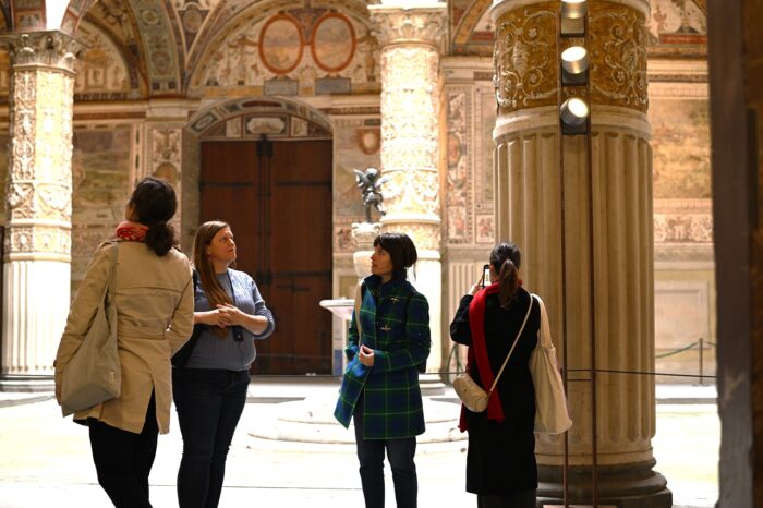 a group of people standing in front of a building