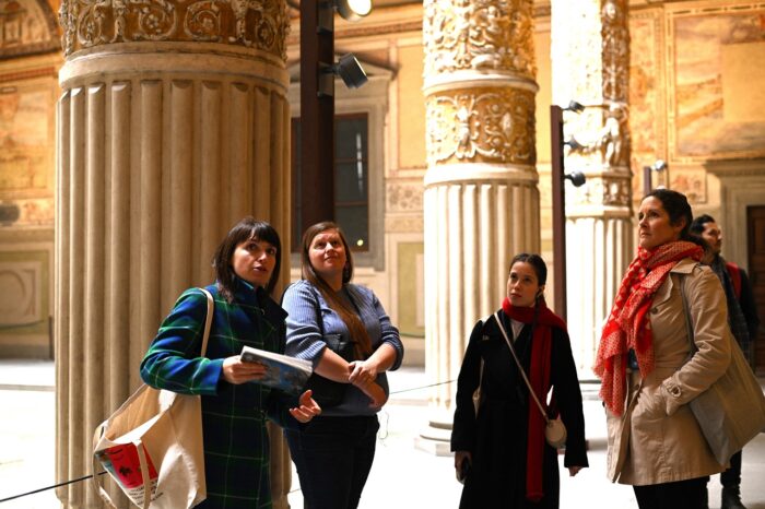 a group of people standing in front of a building