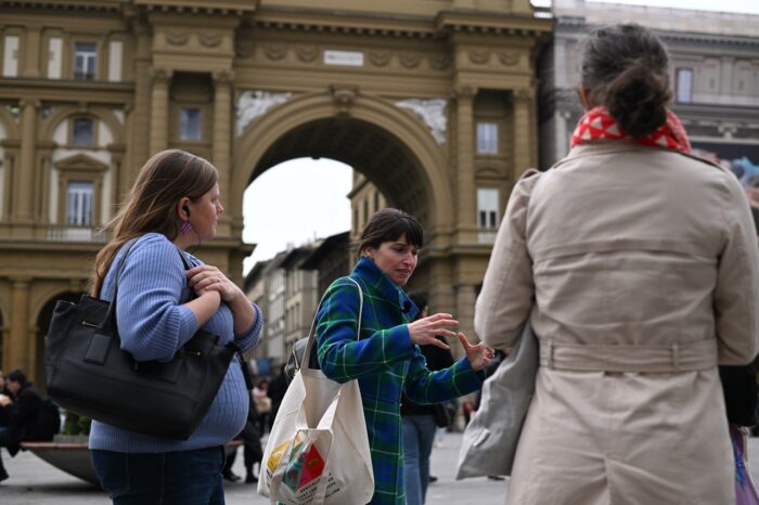a group of people standing in front of a building
