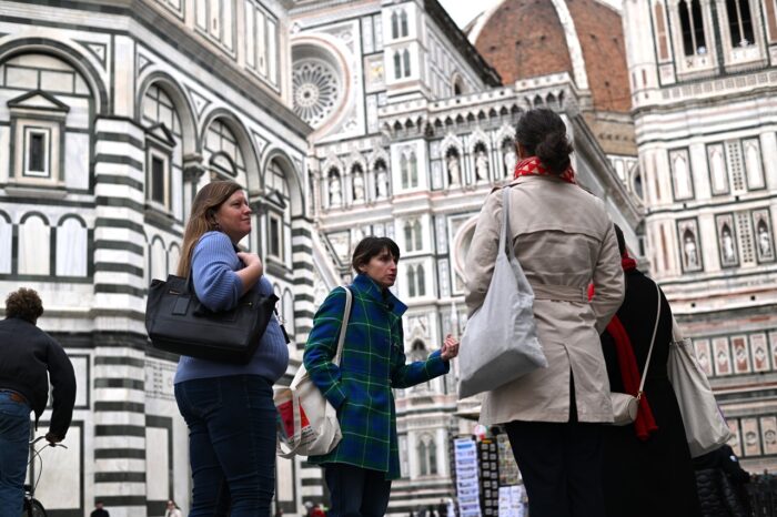a group of people standing in front of a building