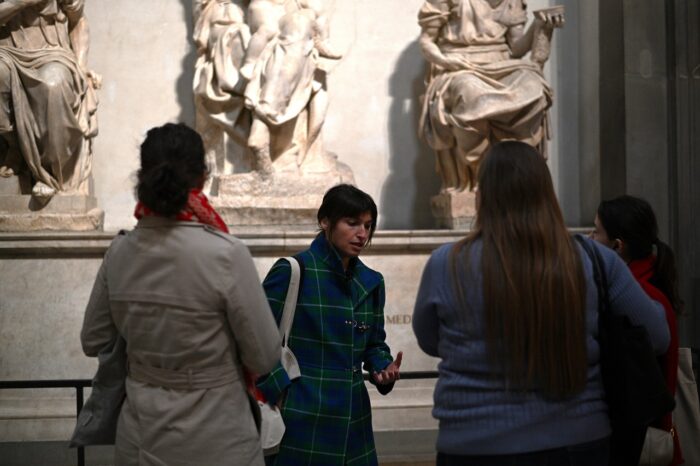 a group of people standing in front of a crowd