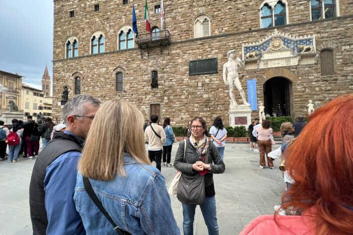 a group of people standing in front of a building