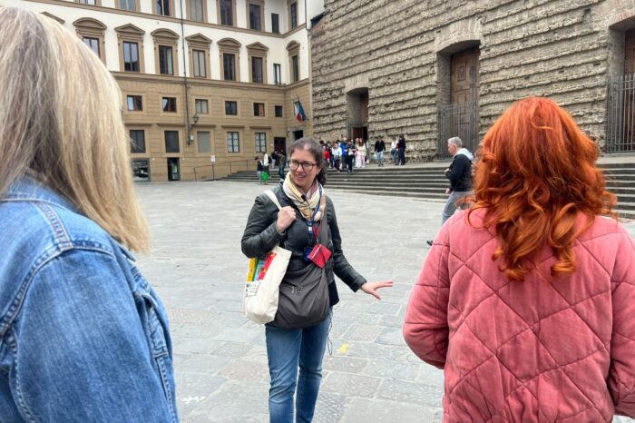 a woman standing in front of a building