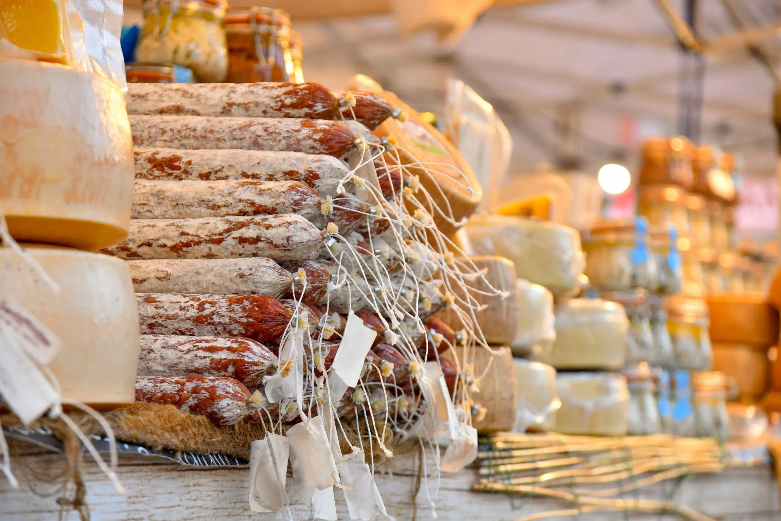 Market,Stall,Of,Farmer's,Market,With,Cheeses,,Sausages,And,Vergine