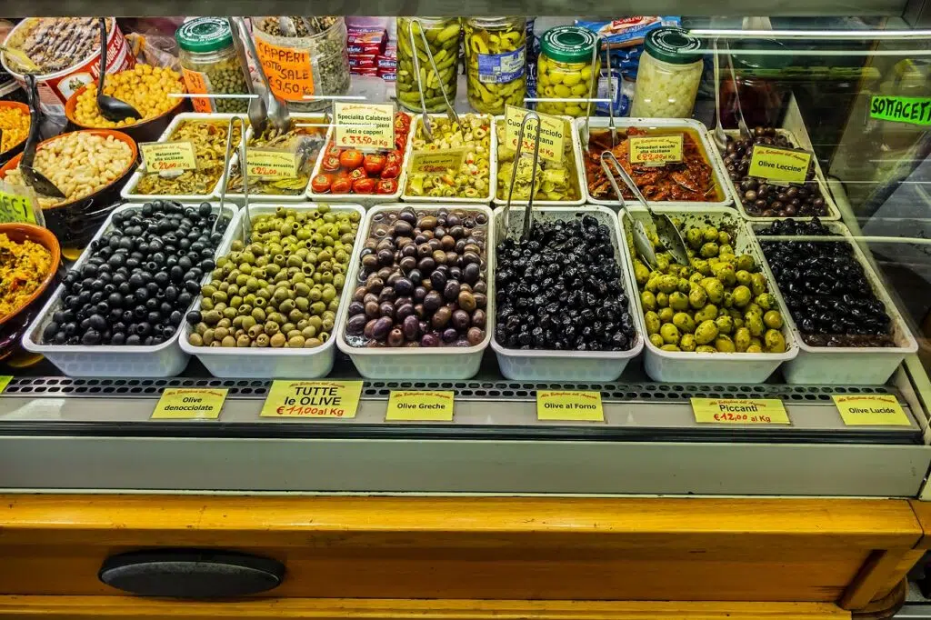 fresh olives on a counter in Sant’Ambrogio Market