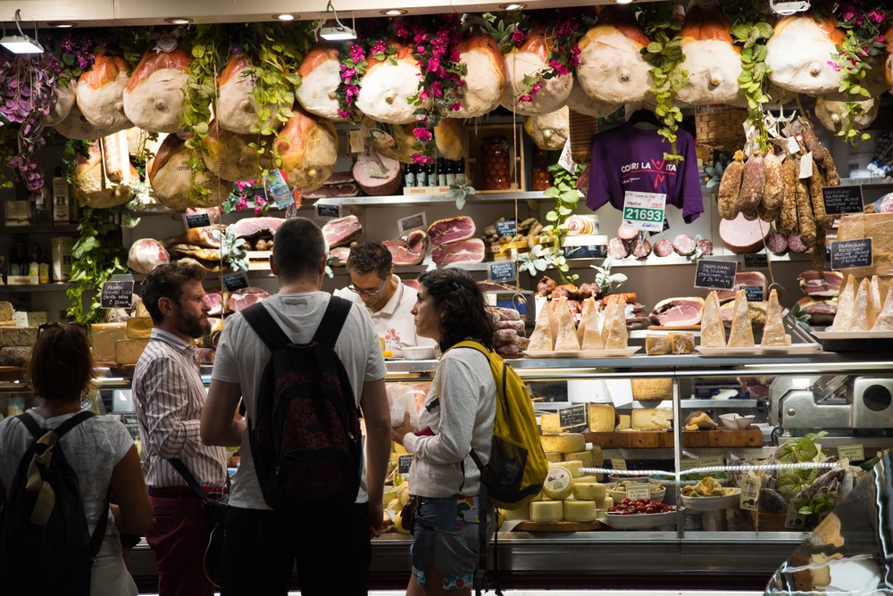travelers browsing wares in one of the local European markets