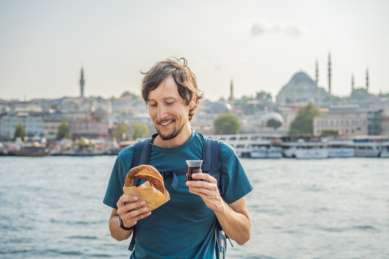 Man,In,Istanbul,Having,Breakfast,With,Simit,And,A,Glass