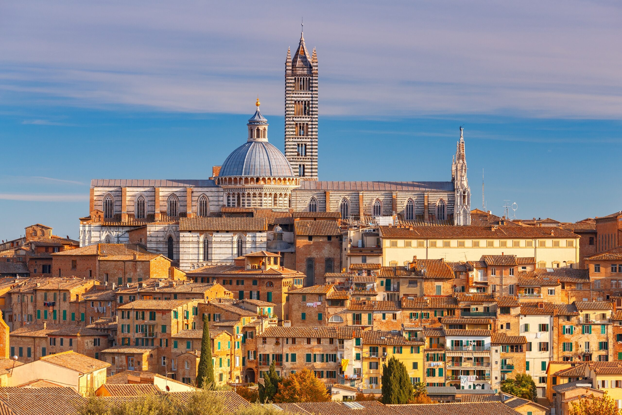 Siena Cathedral facade — black and white marble Duomo in Siena, Italy