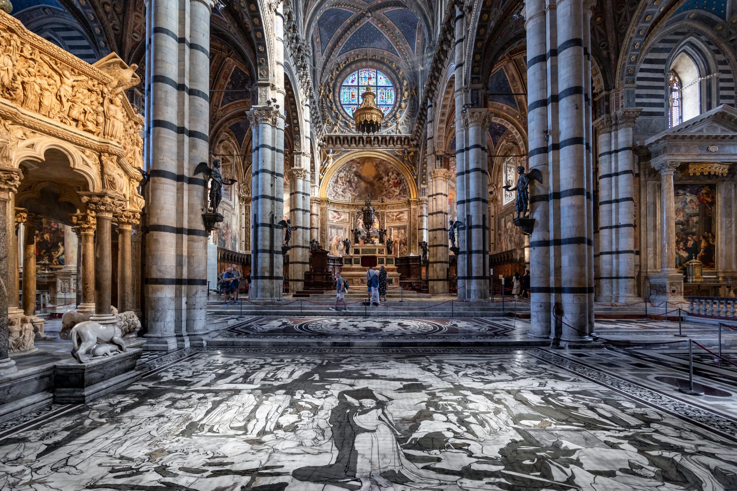Siena Duomo interior — black and white marble columns and inlaid marble floor, Siena Cathedral Italy