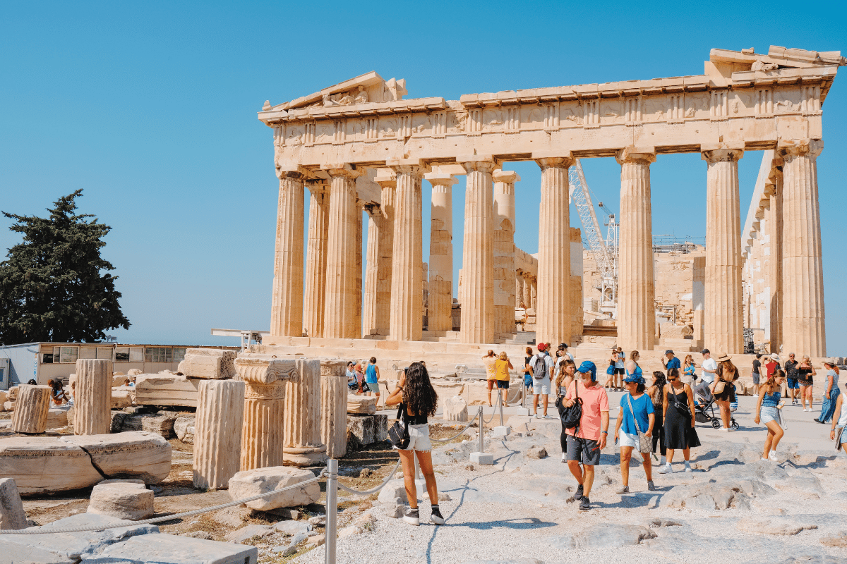 Travelers exploring the Parthenon on the Acropolis in Athens on a private guided tour of ancient sites in Europe