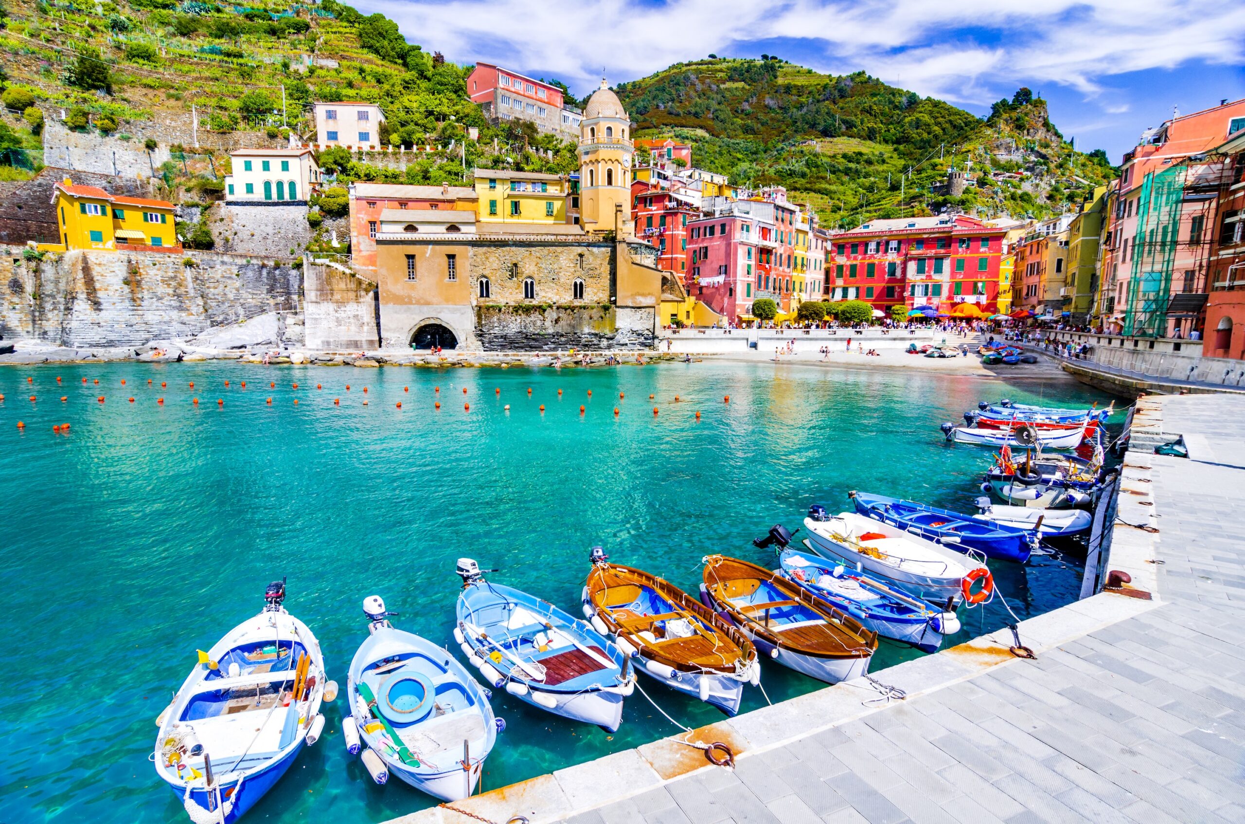 Colorful cliffside village of Cinque Terre with harbor boats, Tuscany day trip destination for corporate travel programs