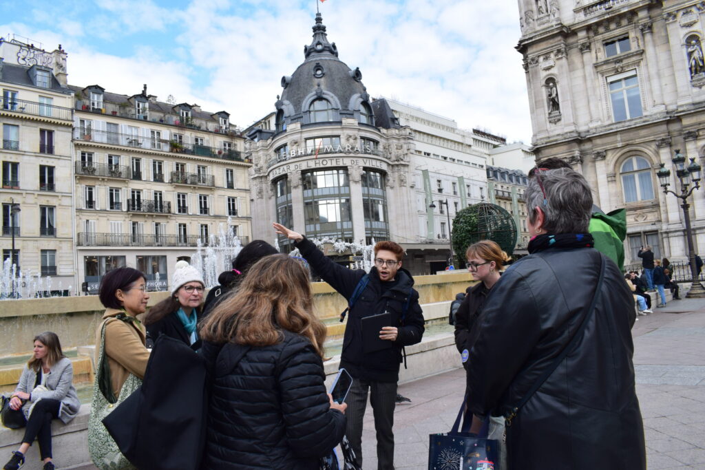 Private tour guide leading a small group through Le Marais, Paris