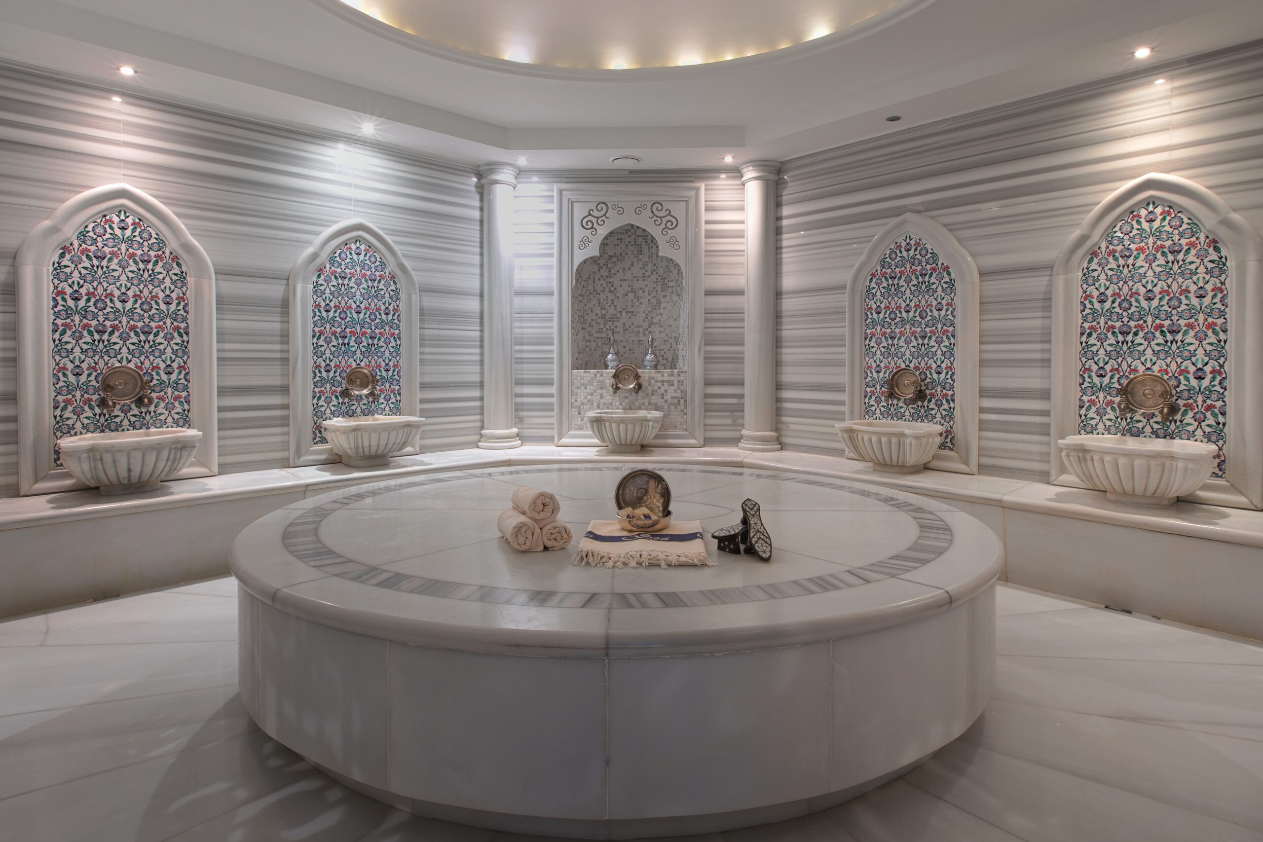 Marble bathing chamber with tiled niches at Zeyrek Çinili Hamam, a restored Ottoman bathhouse in Istanbul