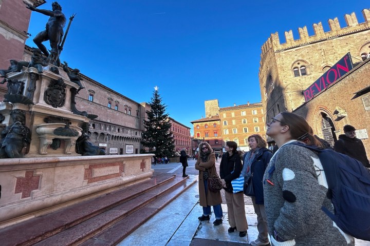 a group of people standing in front of a building